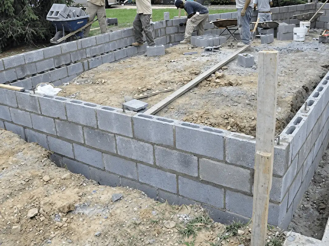 Professionals building a foundation with blocks in Norfolk, VA