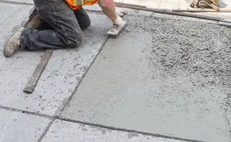 Professional repairing a concrete floor in Norfolk, VA