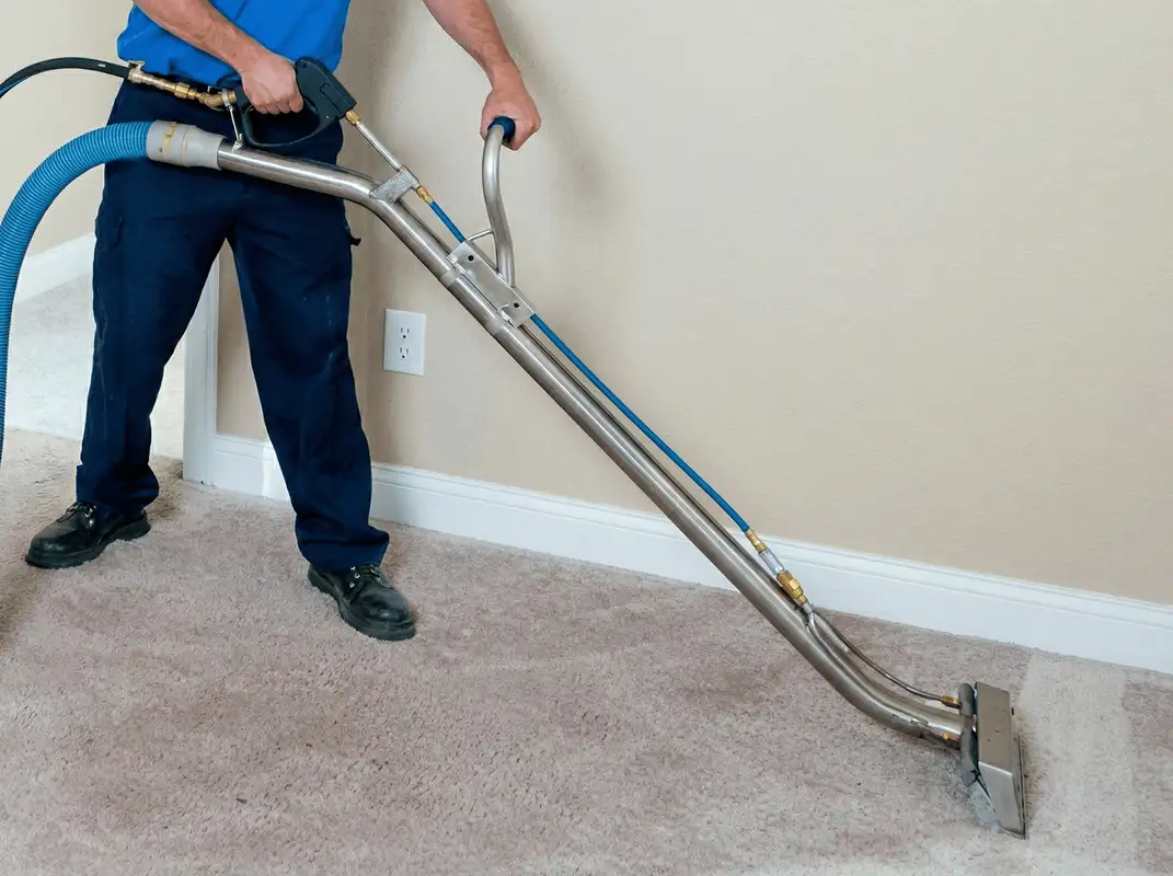 Professional operating a liquid removal machine on a carpeted floor in Norfolk, VA